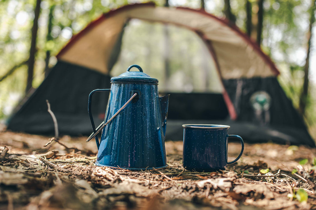 Coffee pot next to tent